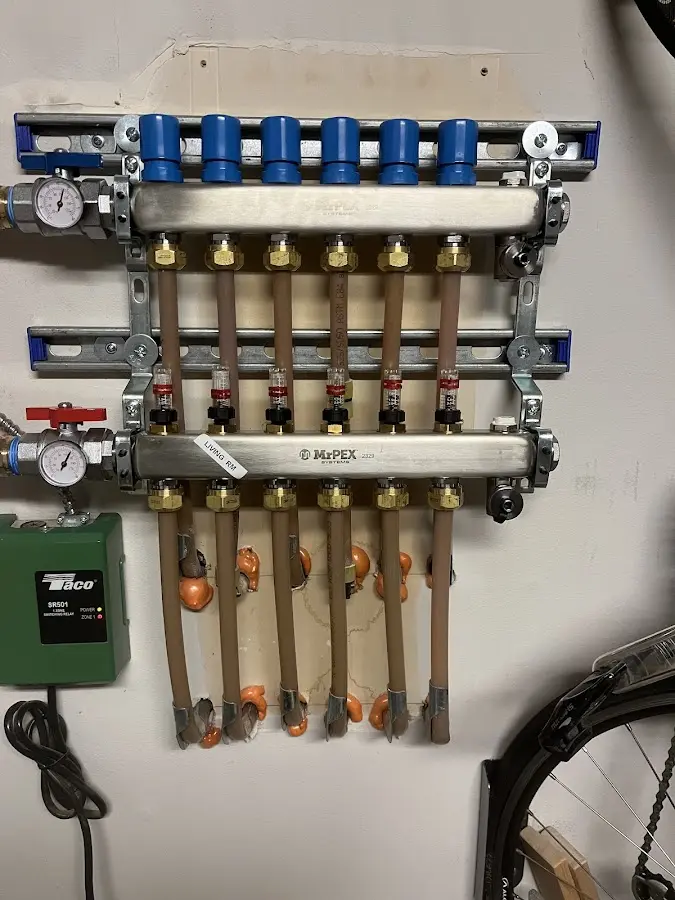 Plumber performing Water Heater Repair at a residential property in Sunapee